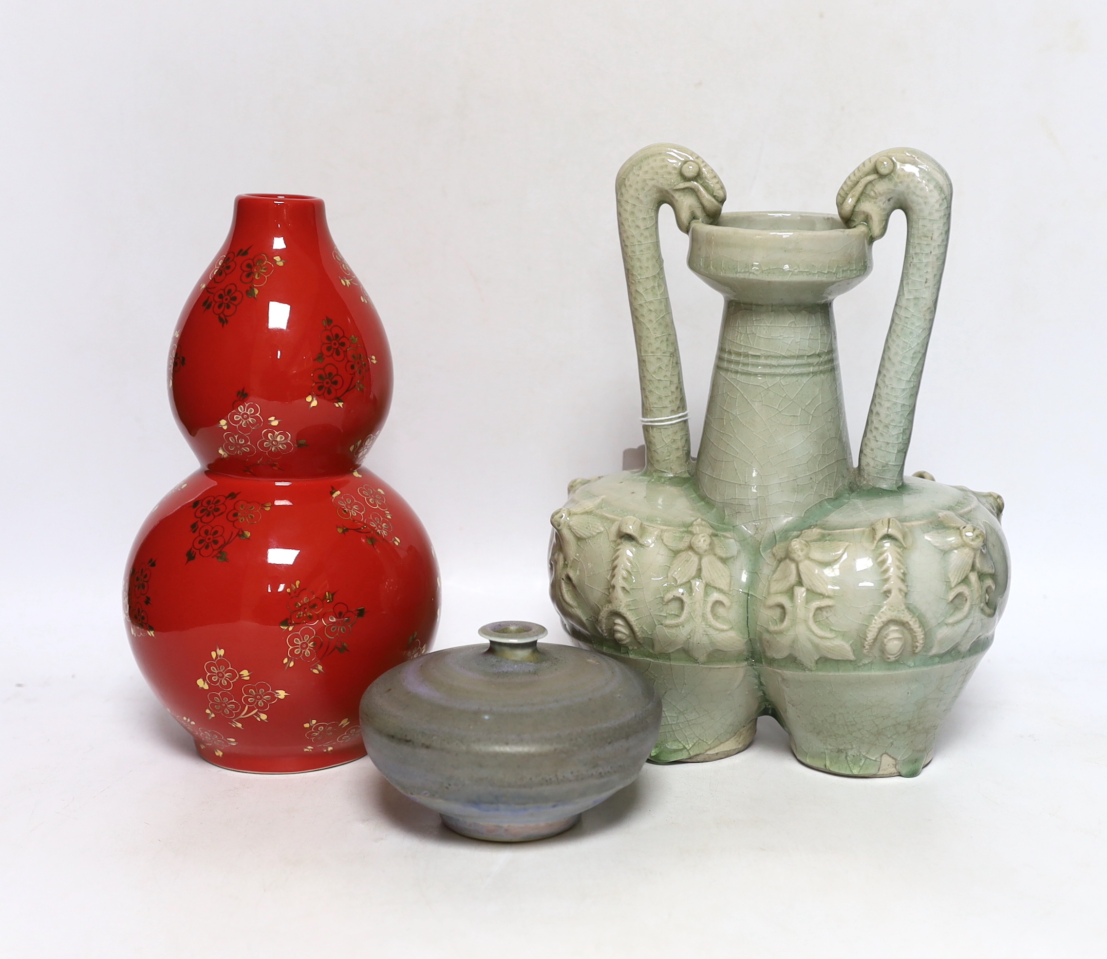A Chinese red ground vase, Chinese celadon conjoined dragon handled vase and a studio pottery vase, 25cm